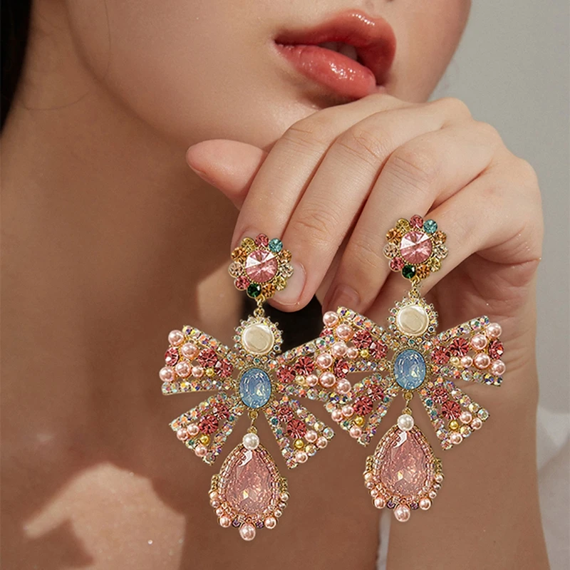 MENGJIQIAO Korean Luxury Pink Rhinestone Bowknot Drop Earrings For Women Fashion Waterdrop Crystal Pendientes Party Jewelry