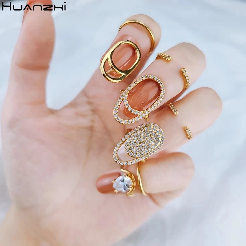 HUANZHI 2020 New Rhinestone Hollow Metal Trendy Cool Fingertip Nail Shining Armor Ring for Women Girls Jewelry Party Accessories